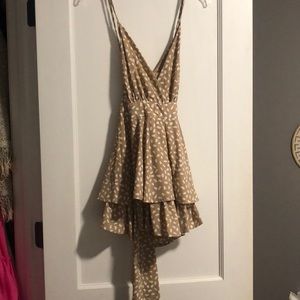 Cute romper! crosses in back! Never worn!